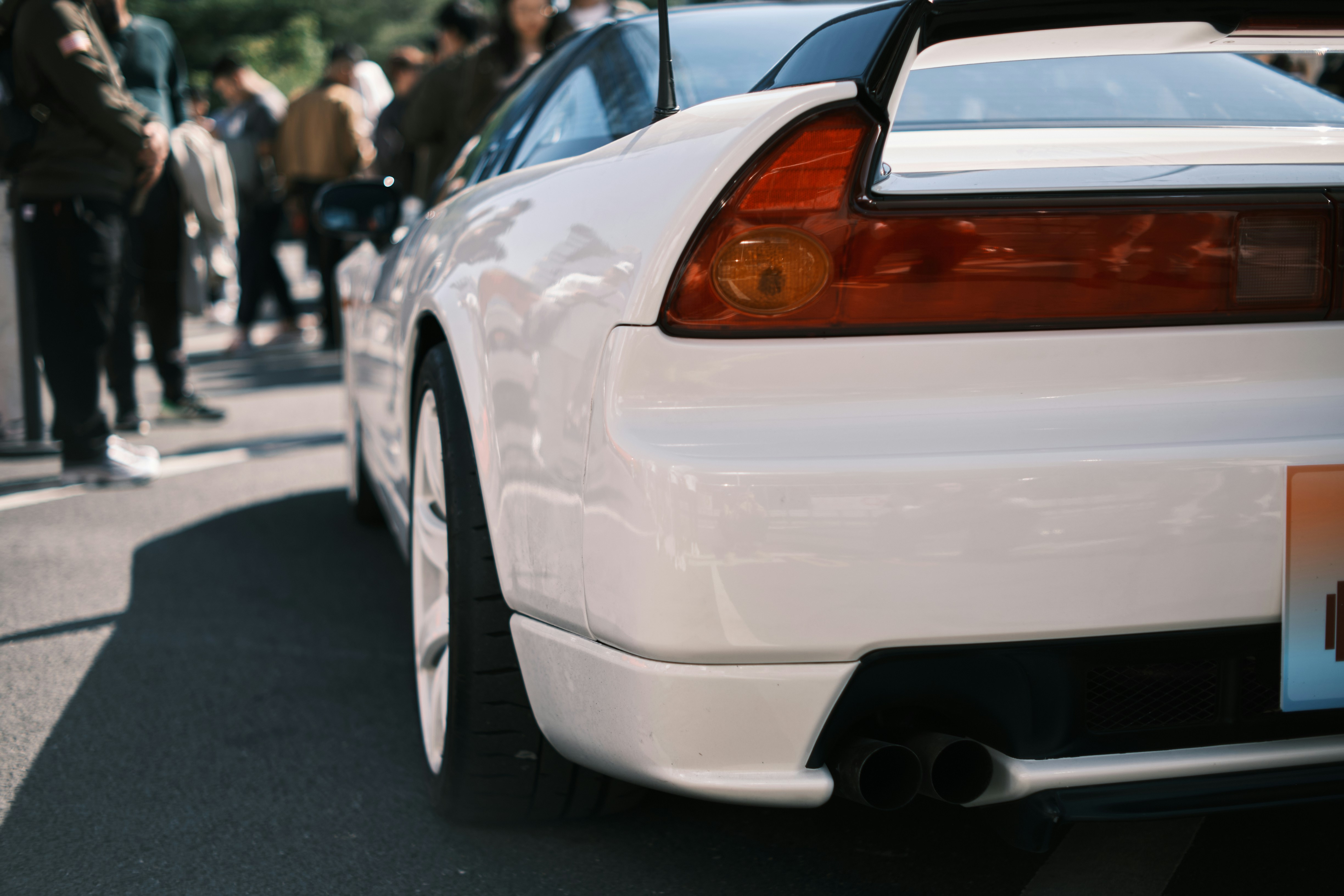 a white car parked on the side of the road