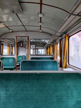 Vintage sleeper train carriage interior with cozy beds.