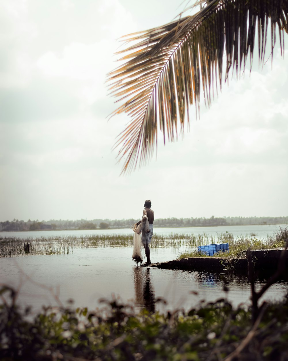 a man and a woman are standing in the water