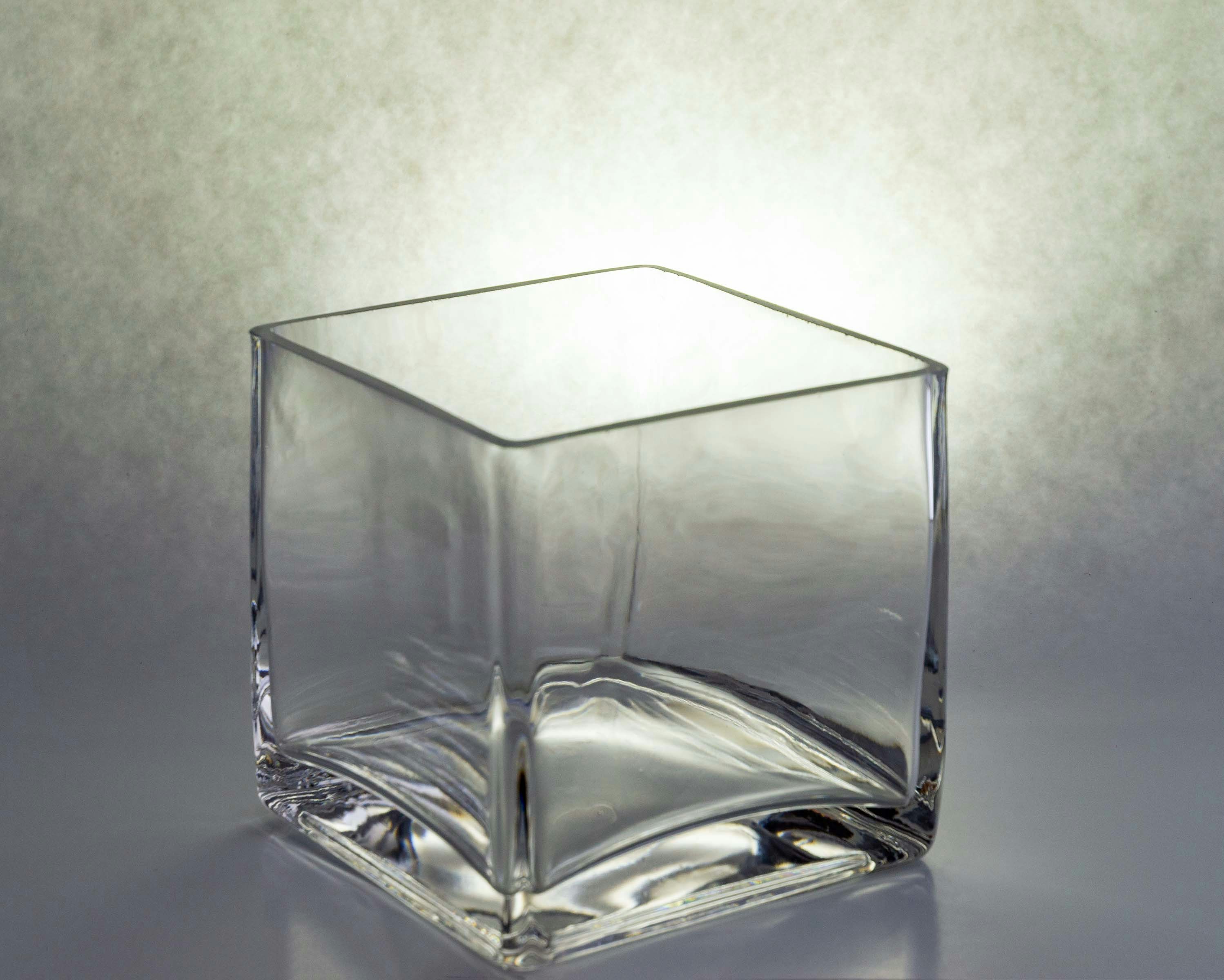 Elegant clear glass vase with minimalist design on white background