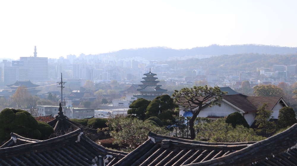 a view of a city with mountains in the background