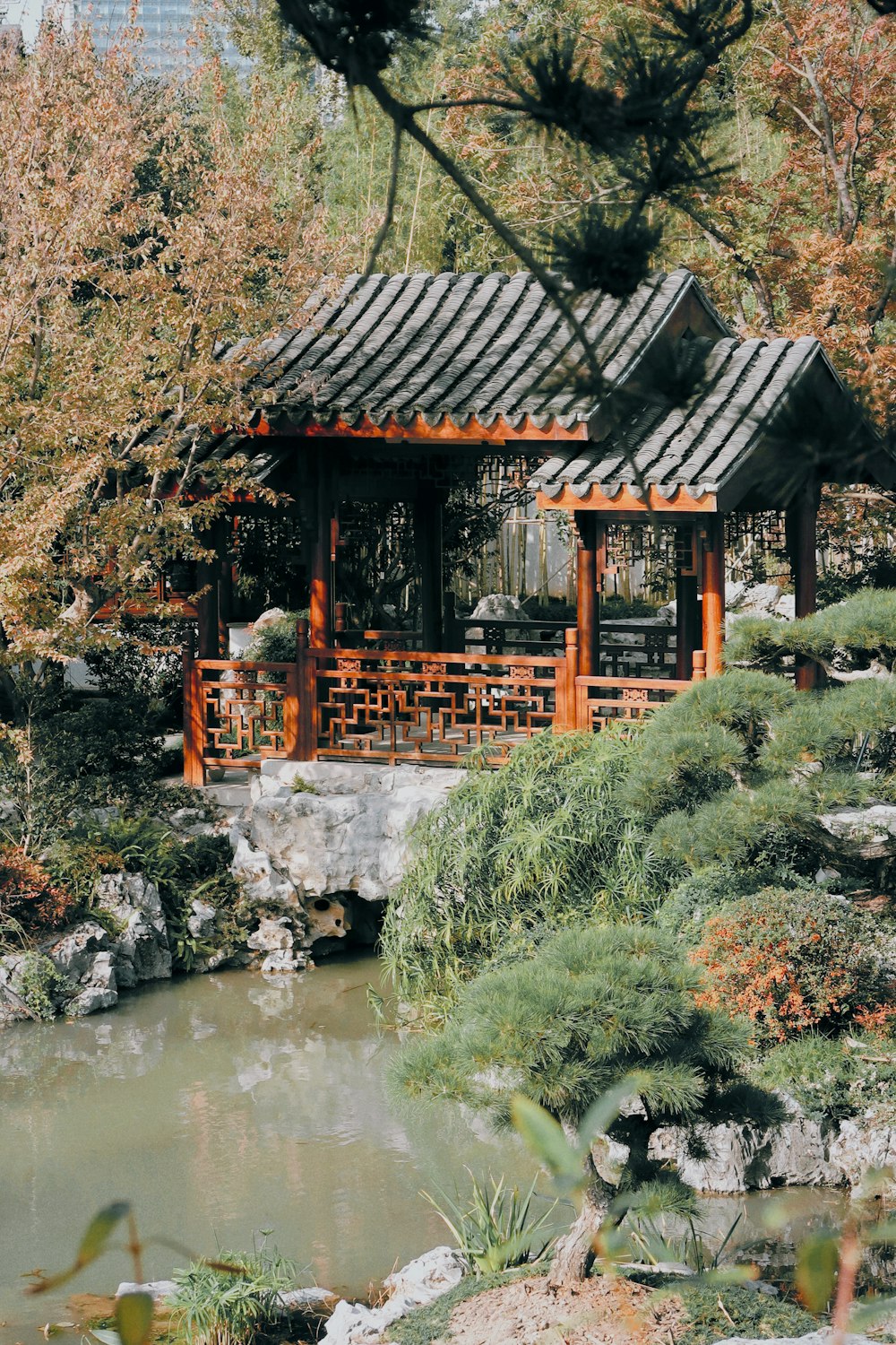 a small wooden building sitting next to a river