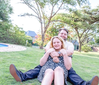 A happy couple enjoying a casual outdoor date in a park.