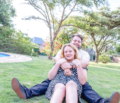 A happy couple enjoying a casual outdoor date in a park.