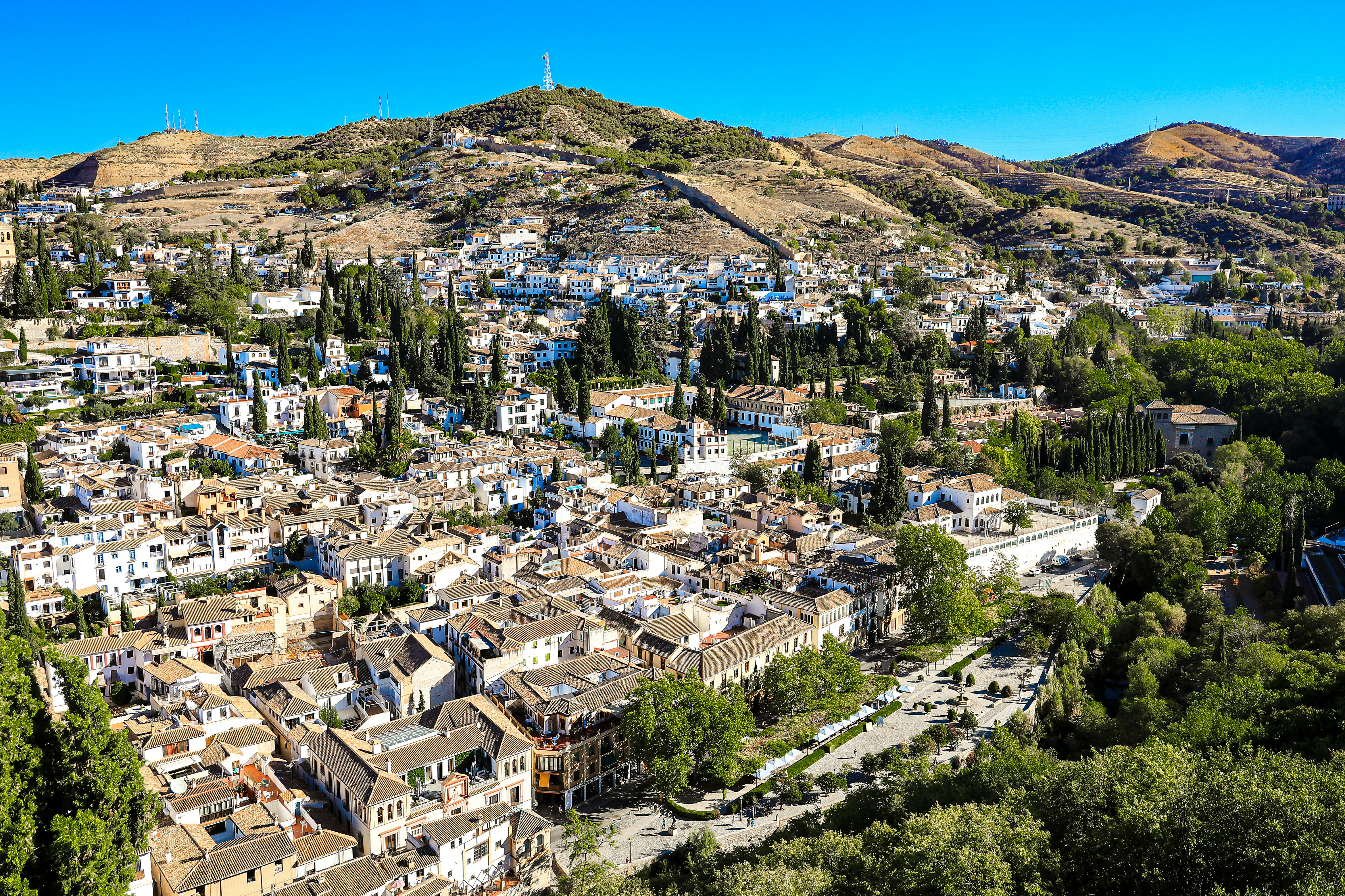 a view of a small town in the mountains