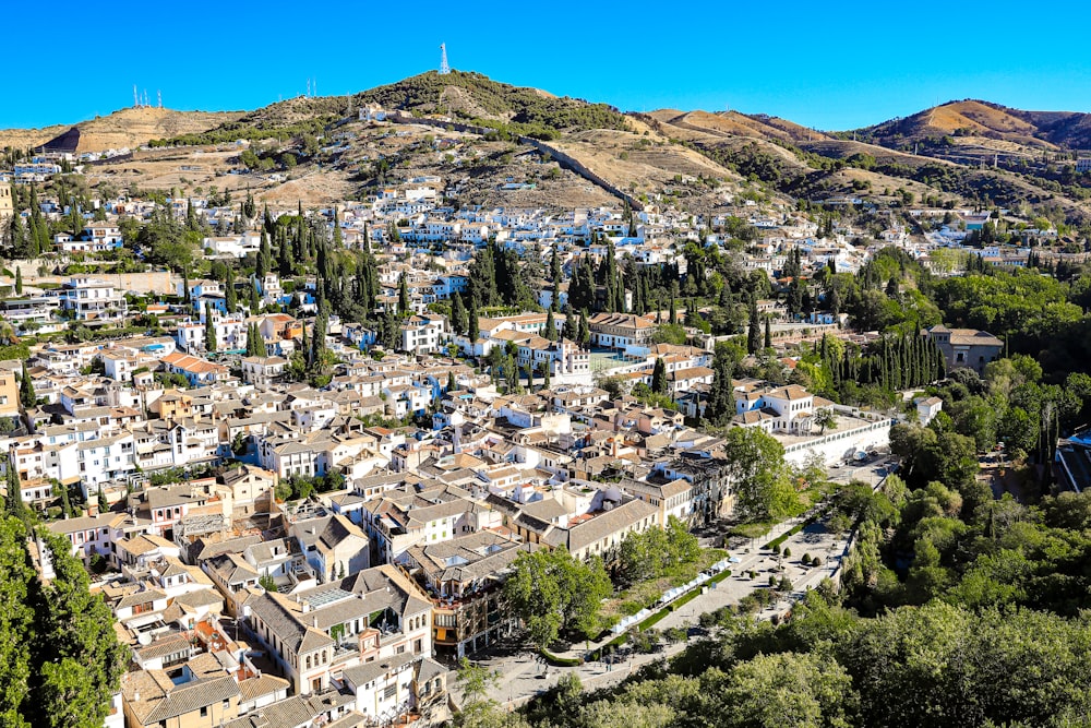 a view of a small town in the mountains