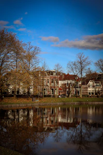 A peaceful lakeside neighborhood in New Hampshire with charming homes and autumn foliage.