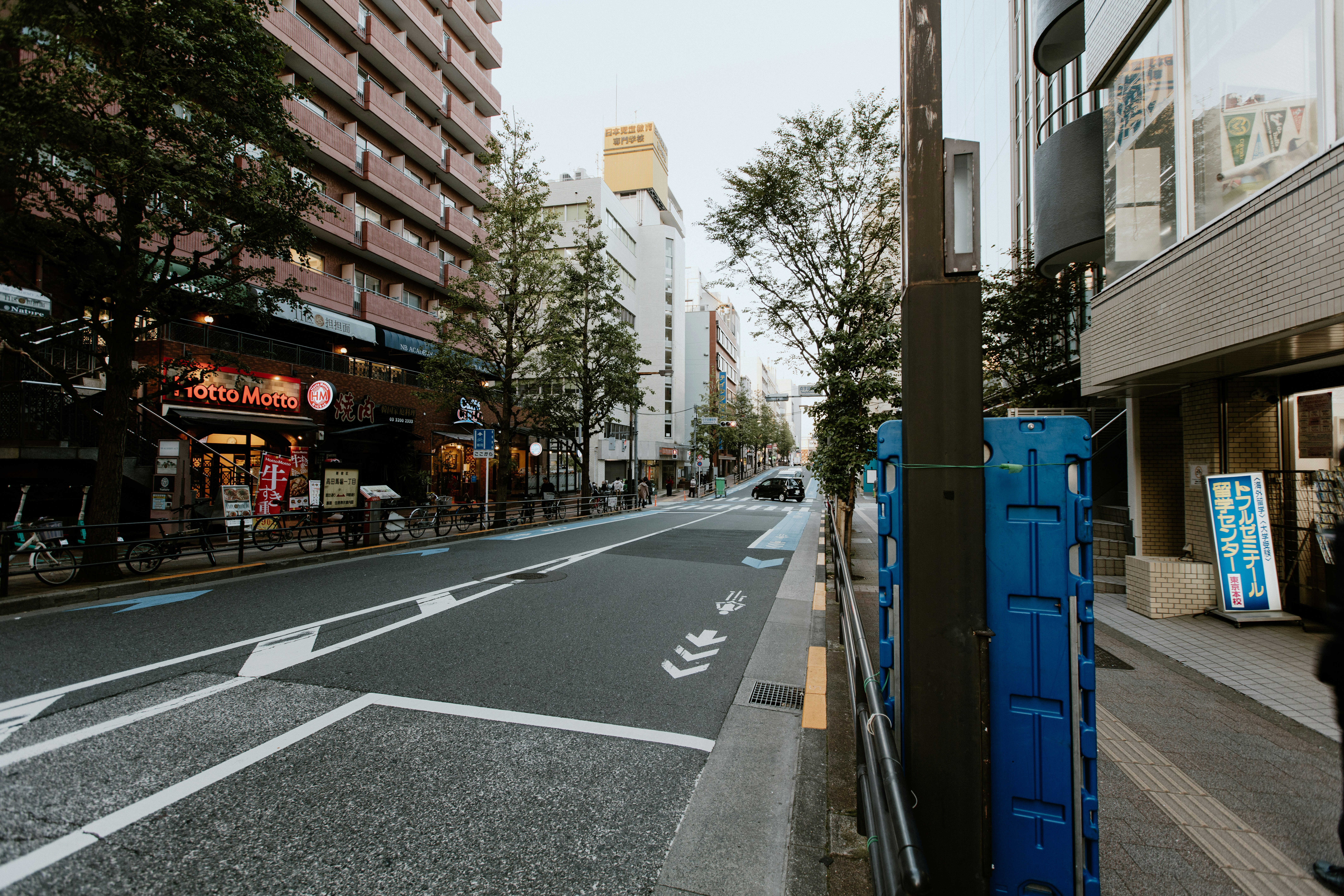 A city street with tall buildings