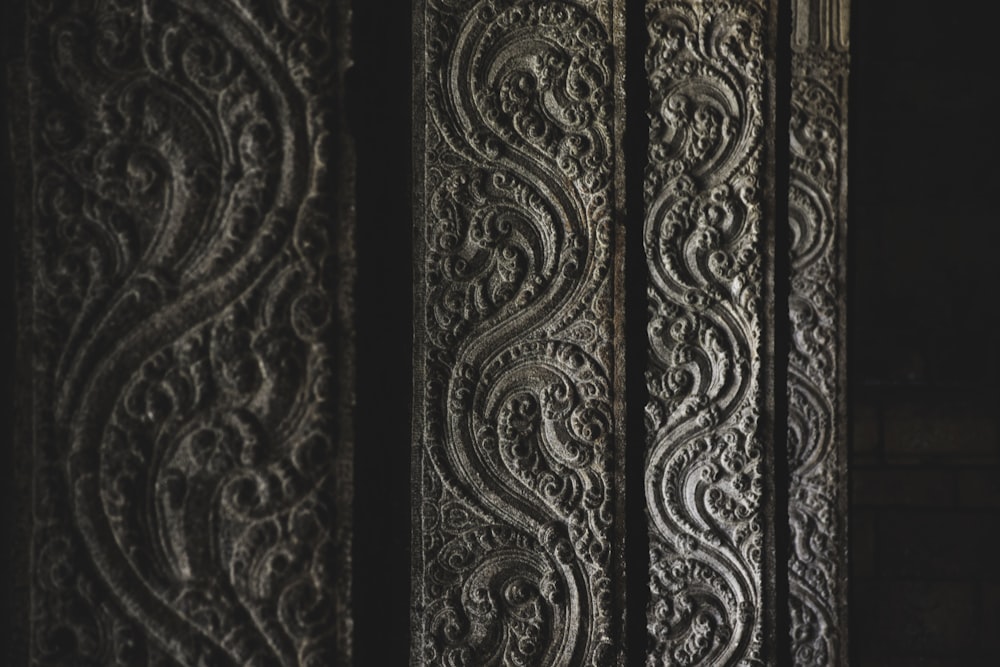 a close up of a metal door with intricate designs