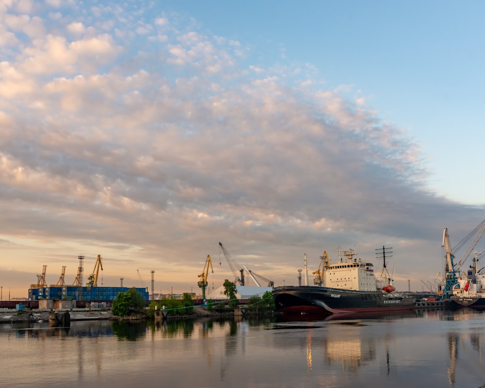 a harbor filled with lots of boats under a cloudy sky