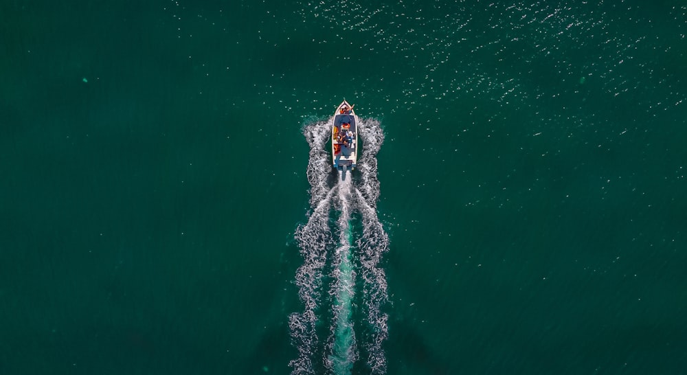a person riding a boat in the middle of the ocean