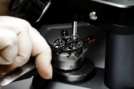 Artisan carefully assembling a limited-edition watch.
