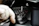 Close-up of a skilled technician repairing a complex cutting die in an industrial workshop.