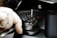 A close-up of a luxury watch being carefully repaired by a skilled technician.