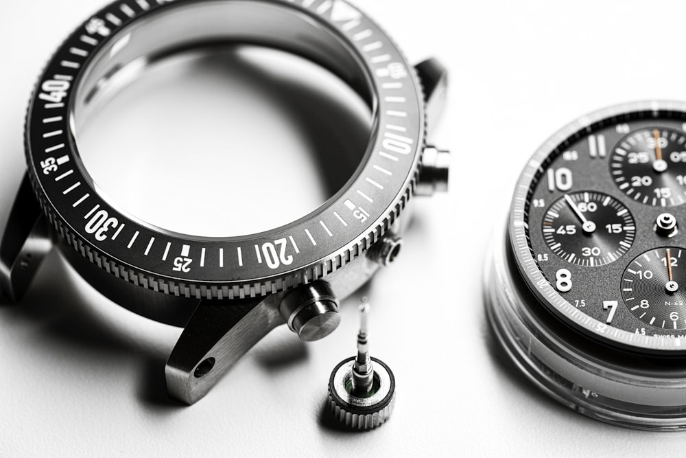 a close up of a watch on a white surface