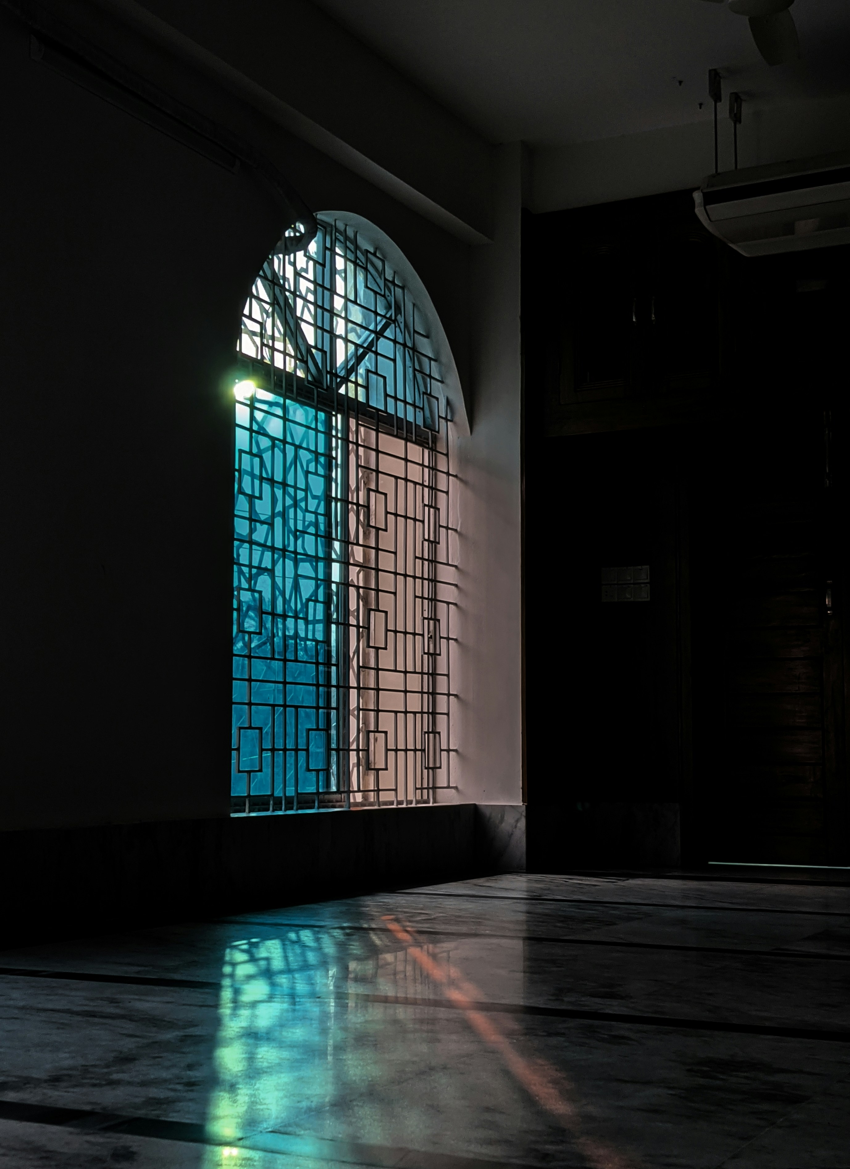 a room with a large stained glass window