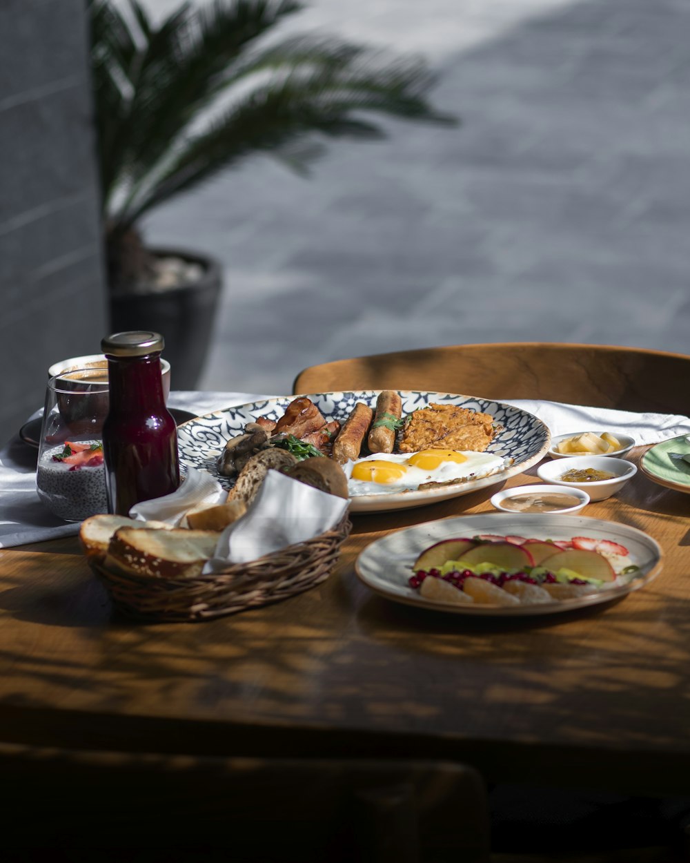 a wooden table topped with plates of food