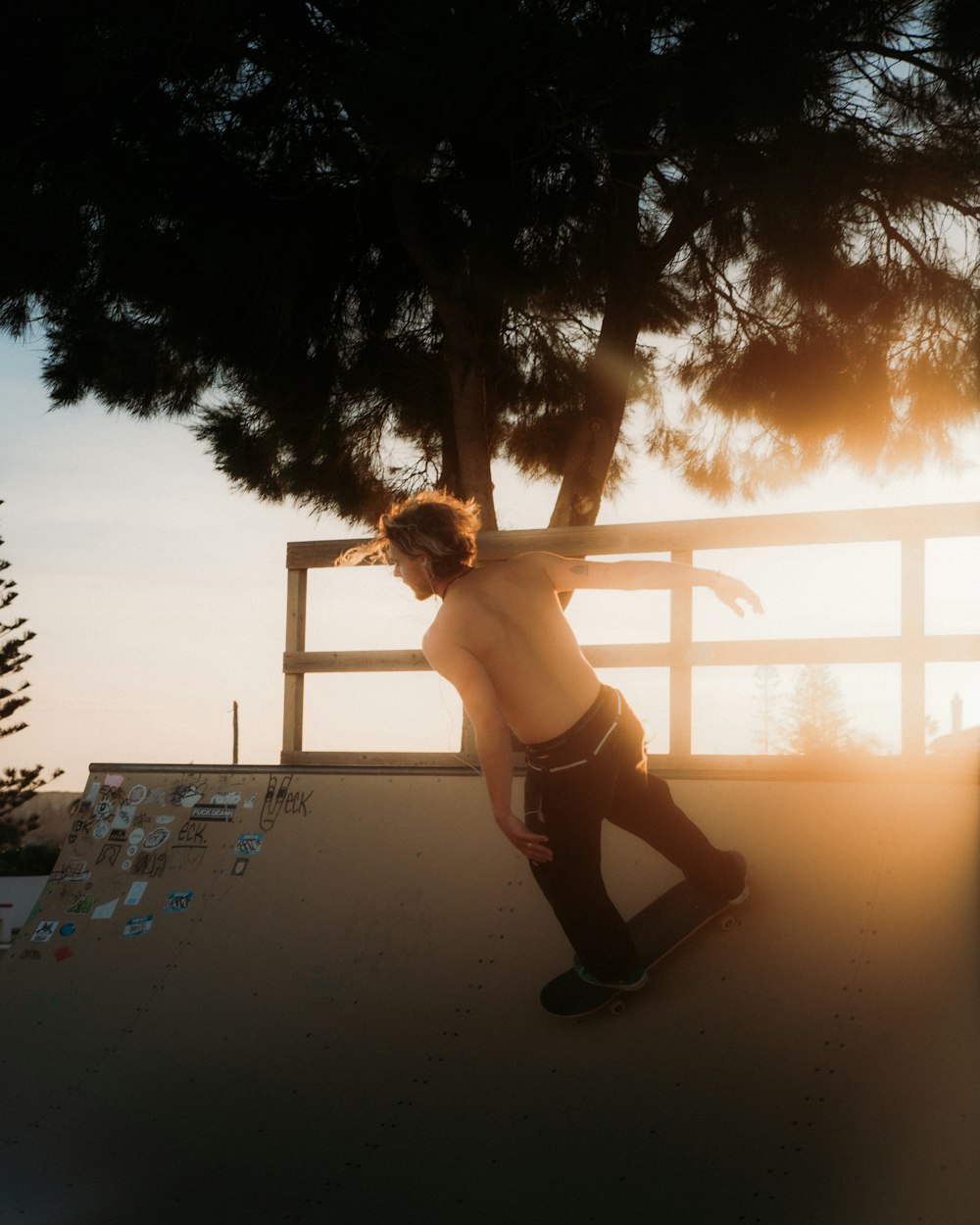 a man riding a skateboard up the side of a ramp