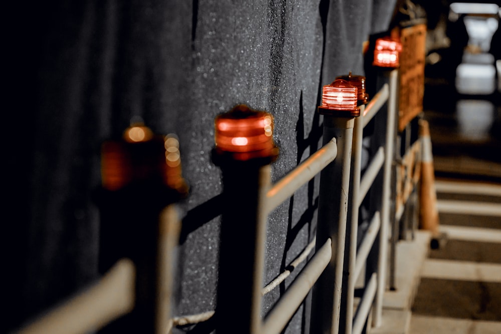 a row of lights on the side of a building