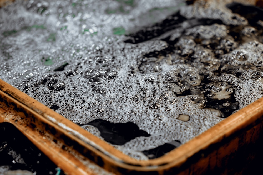 a wooden tray filled with lots of water