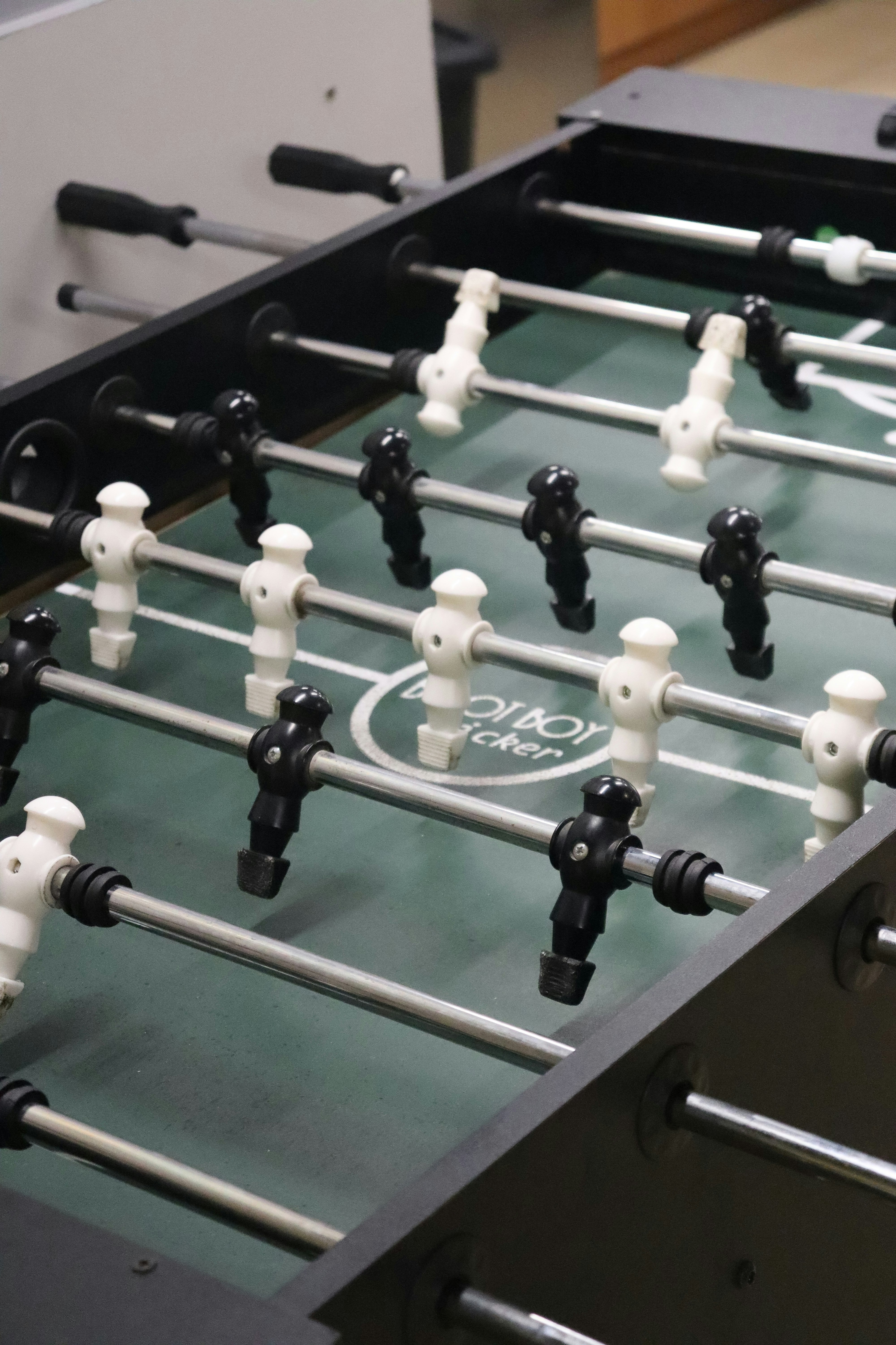 A close up of a foosball table in a room photo – Free Grey Image on ...