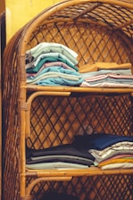 A beautifully organized closet featuring bamboo shelving and recycled bins.