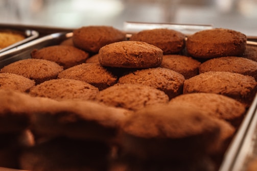 Close-up of freshly baked cookies arranged neatly on a wooden tray.