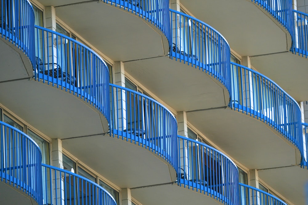 a building with balconies and blue balconies