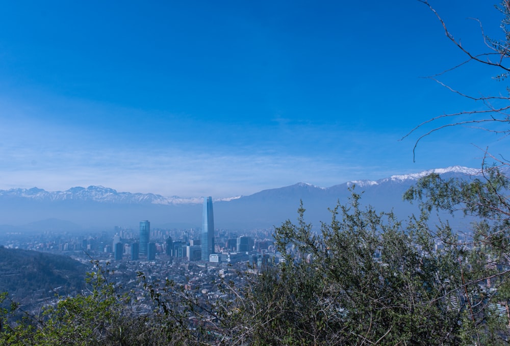 a view of a city with mountains in the background