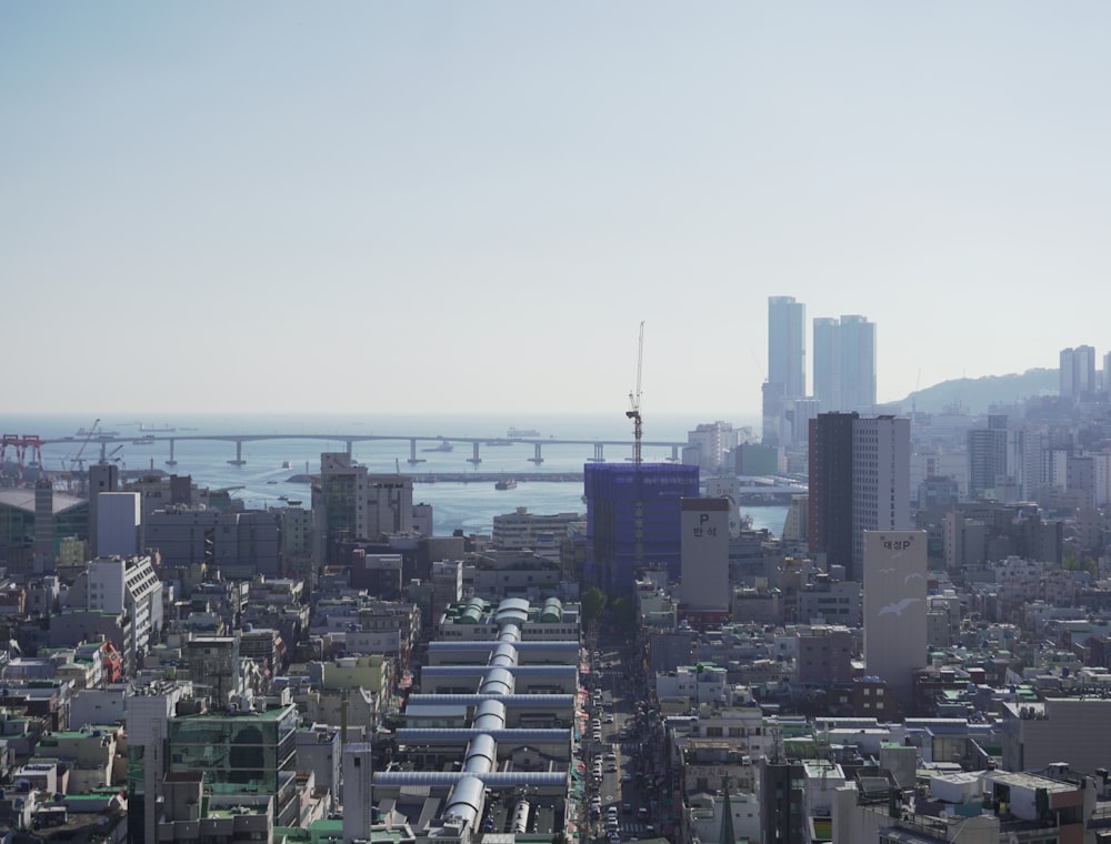 a view of a city with a bridge in the distance