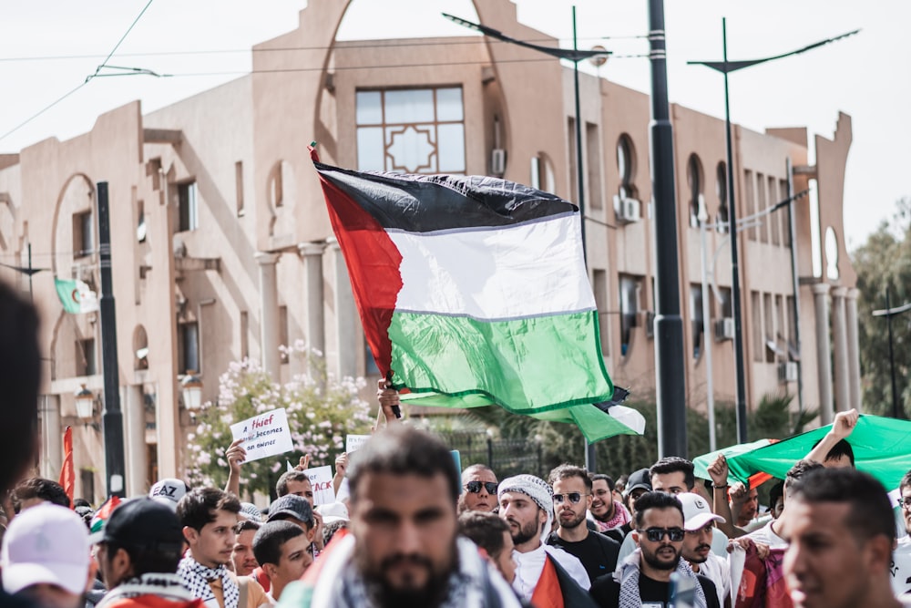 a large group of people walking down a street