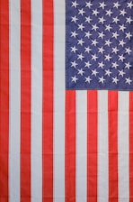 a large american flag with white stars on it