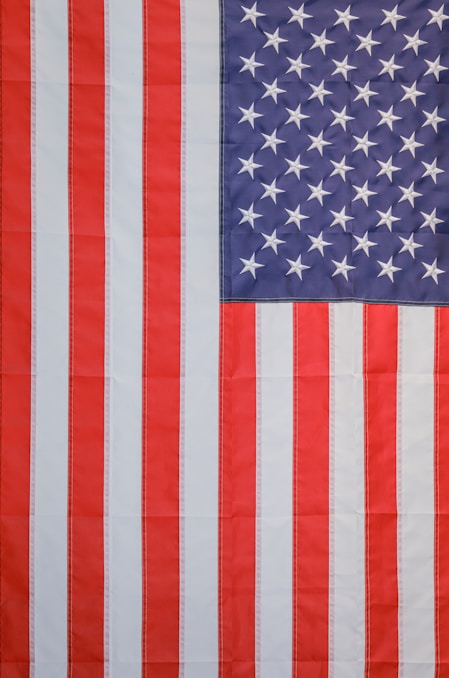 a large american flag with white stars on it