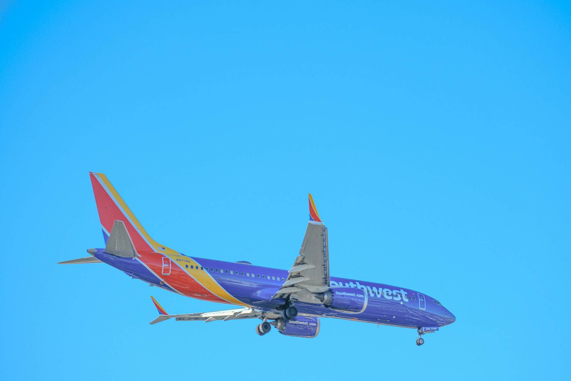 woman wearing yellow long-sleeved dress under white clouds and blue sky during daytime