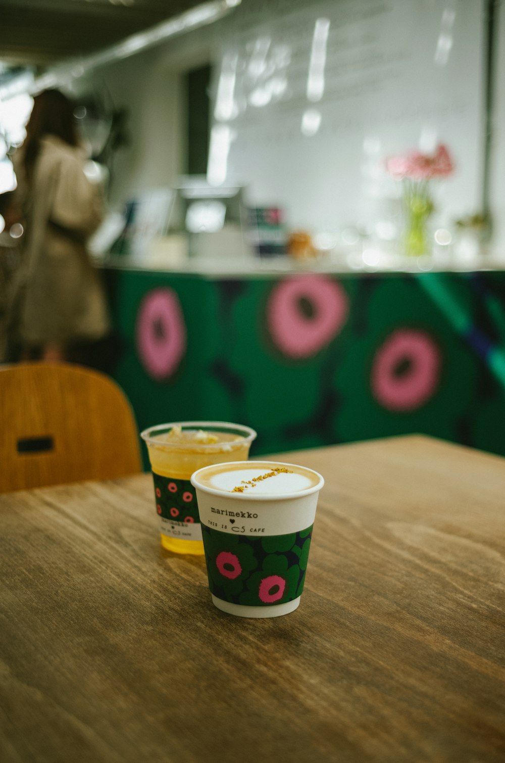 a couple of cups sitting on top of a wooden table