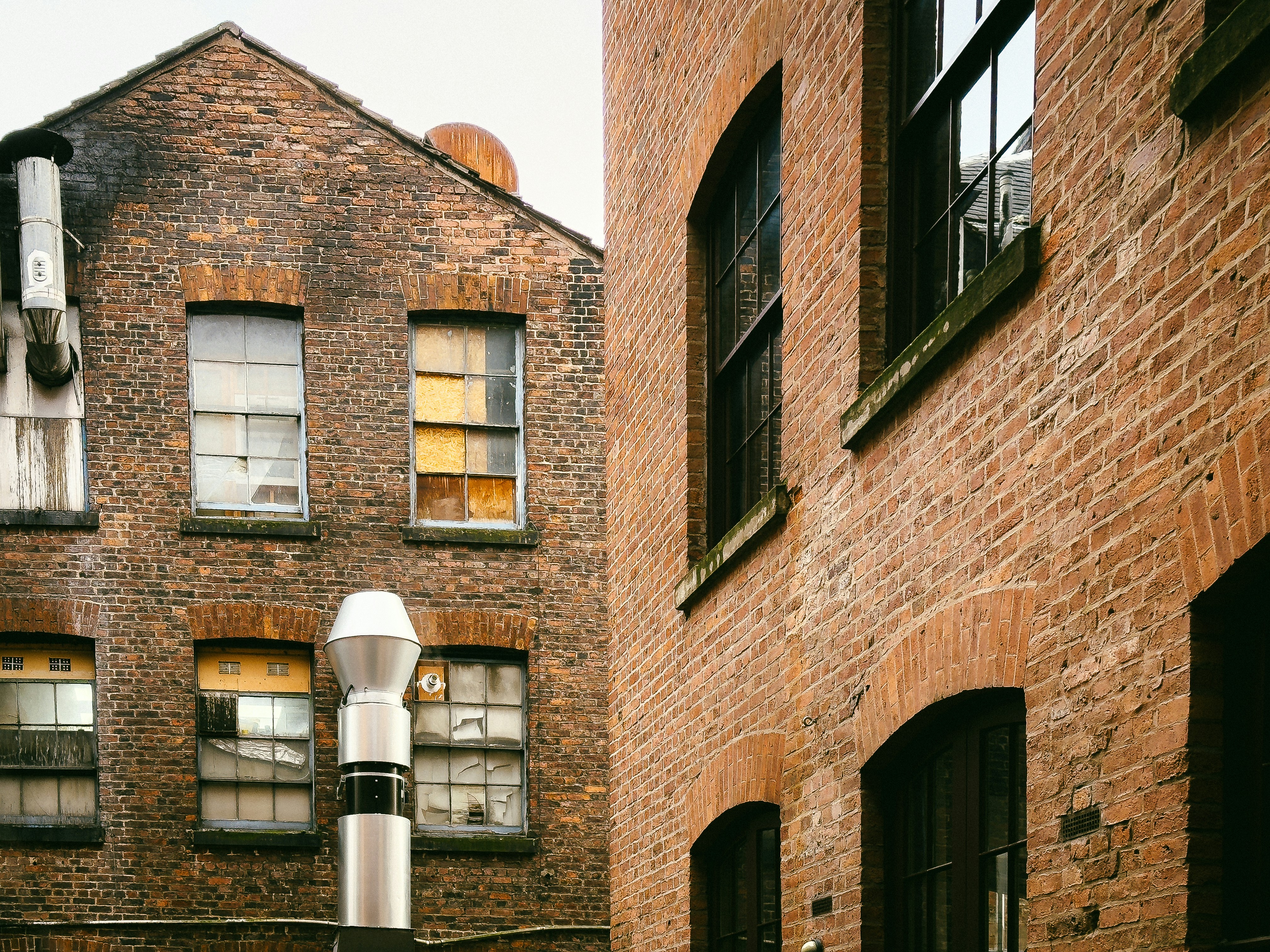 a street light in front of a brick building, 