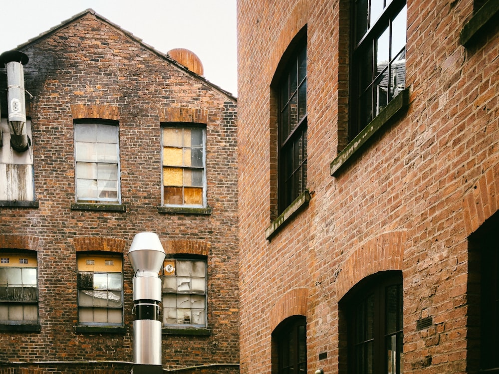 a street light in front of a brick building