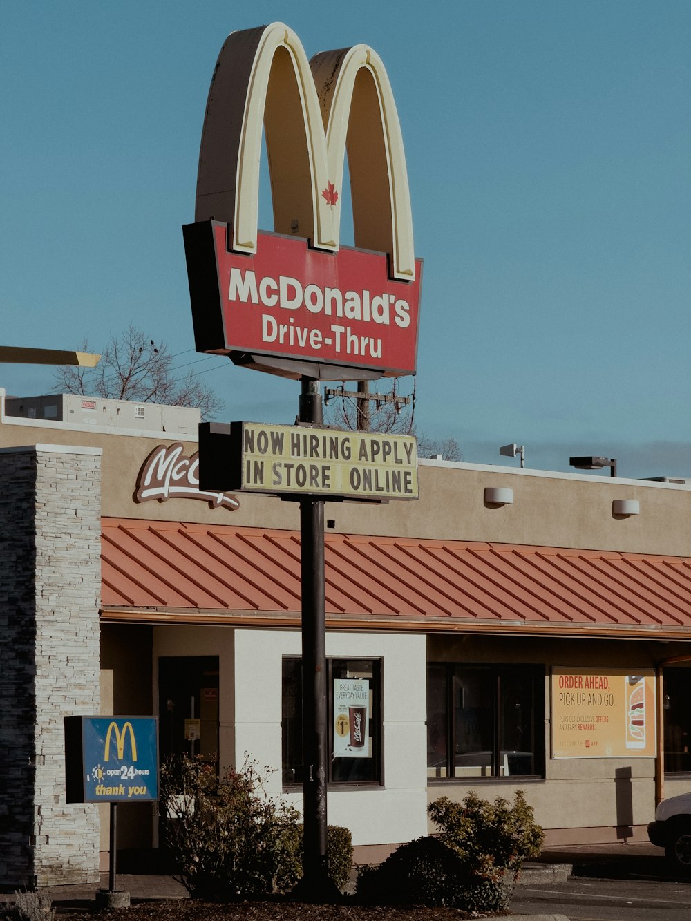 a mcdonald's drive thru sign in front of a store