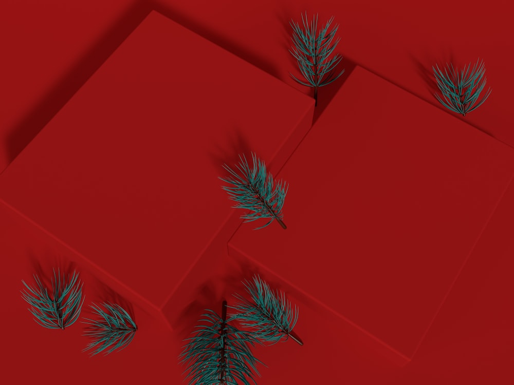 a red background with green leaves on it