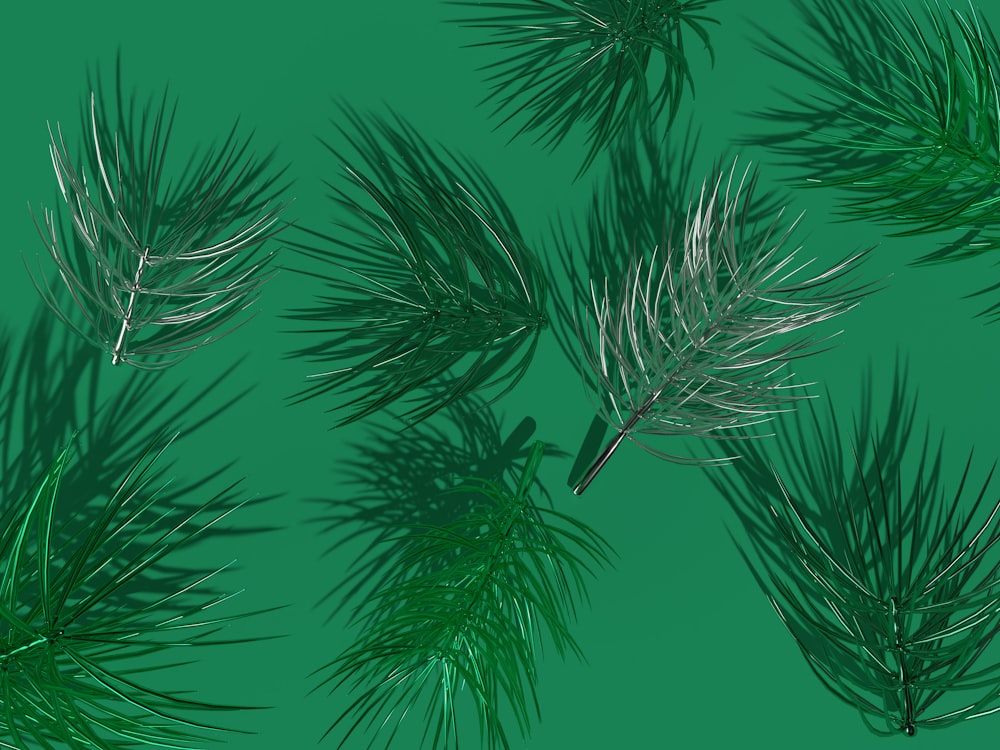 a bunch of pine needles on a green background