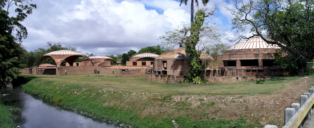 a large building sitting next to a river