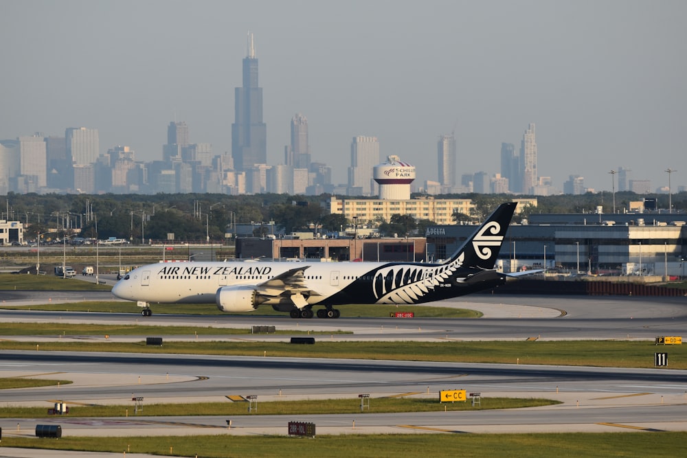 a large jetliner sitting on top of an airport runway