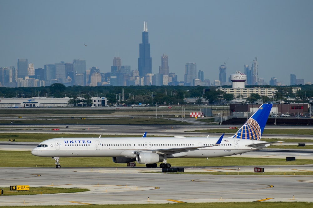 a large jetliner sitting on top of an airport runway