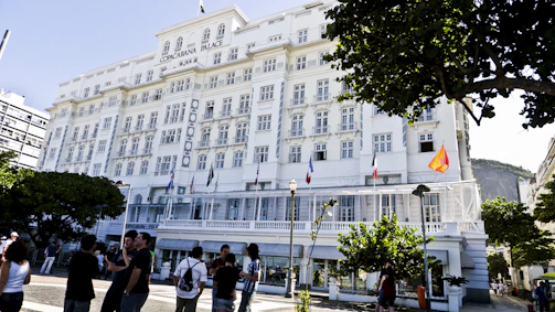 Group of students visiting a historic hotel for hands-on learning.