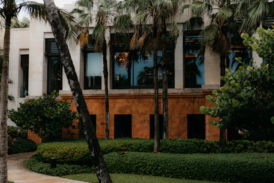 Detailed 3D exterior render showcasing a contemporary building facade with natural tones.