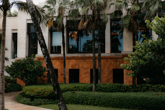 Exterior shot of a commercial building with a stylish facade and landscaped surroundings