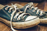 A stylish pair of sneakers showing subtle signs of previous adventures.