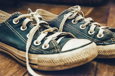 A stylish pair of sneakers showing subtle signs of previous adventures.