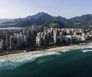 A sleek Manila skyline at dusk blending into a serene luxury beach villa, symbolizing balance between business and leisure.