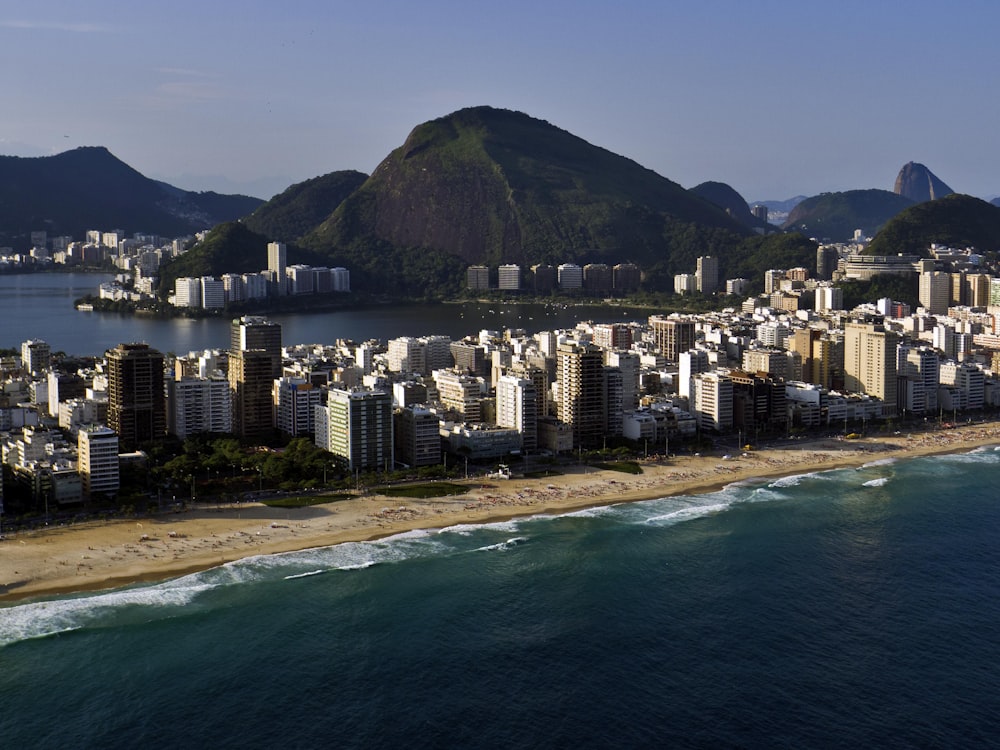 an aerial view of a city next to the ocean